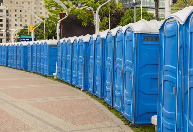 colorful portable restrooms available for rent at a local fair or carnival in Colbert